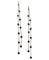 Fire up your evening with these two-row linear earrings from GUESS. Amythest, fuchsia and rose crystal-embellished fireballs hang from metal chains. Crafted in sprayed jet mixed metal. Approximate drop: 7 inches.