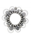 Pretty and practical: Sandblasted paillettes and delicate beads embellish this bracelet from Style&co., while the stretch design gives it a flexible fit. Made in hematite tone mixed metal. Approximate diameter: 2-1/4 inches.