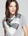 Wrap yourself in style with a sheer, woven wool scarf featuring Burberry's iconic check pattern in ivory, black and red.