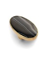 THE LOOKA dramatic black oval with veins that give the look of stonePolished tapered settingNarrow polished bandTHE FITLength, about 2¼Width, about 1¼THE MATERIALGlass18k goldplatingORIGINImported