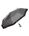 With polka dots and a ruffle trim, Bloomingdale's umbrella adds a shot of retro glamour to your rainy day look.