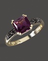 Black diamonds accent a faceted amethyst, set in 14K yellow gold.