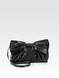 A feminine design of dotted velor on faux leather, topped off with a front bow and shiny patent leather strap. Adjustable patent leather shoulder strap, 23½-25 dropMagnetic flap closureOne inside zip pocketCotton lining11½W X 7½H X 1½DMade in Italy