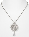 A gorgeous crystal-decked pendant defines this Carolee necklace, which hangs from a simply styled silvery chain.