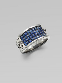 A tapered design in rhodium plated sterling silver is defined by four rows of tiny blue sapphires.Sterling silverBlue sapphiresAbout 1½ diamImported