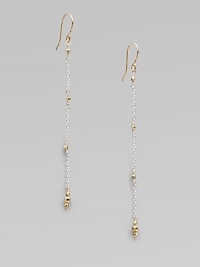 Gracefully dangling strands of sterling silver chain, sprinkled and tipped with glowing faceted beads of 14k gold.14k yellow gold and sterling silverLength, about 2¼Ear wireMade in USA