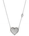 The look of love. Betsey Johnson's pendant is crafted from silver-tone mixed metal with glistening glass crystal accents providing the right amount of sparkle. There's also a subtle stone along the side for that extra bit of dazzle. Approximate length: 16 inches + 3-inch extender. Approximate drop: 1 inch.