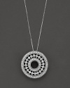 A delicate filigree circle pendant, encrusted with diamonds in 14 Kt. white gold.