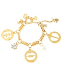 A cut above. Betsey Johnson's multi-charm bracelet is crafted from gold-tone mixed metal with faceted beads and glass crystal accents, adding to the appeal of the charms' cut-out motif. Approximate length: 7-1/2 inches.