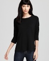 Subtle shoulder pads and an asymmetric hem lend added style and shape to this MARC BY MARC JACOBS sweater.