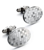 The perfect gift for the sophisticated business man. These sleek oval-shaped cuff links feature a unique checkered design in sterling silver. Approximate length: 1-7/8 inches. Approximate width: 5/8 inch.