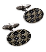 The perfect accent for the modern-day business man. These sleek oval-shaped cuff links feature rounded ends and a unique checkered design. Set in sterling silver with black and grey enamel overlay. Approximate length: 13/16 inch. Approximate width: 1/2 inch.