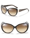 Turn heads in cat eye sunglasses with wild animal print arms and gradient lenses.