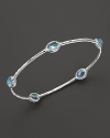 Blue topaz stations sparkle on this textured sterling silver bangle from Ippolita.