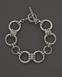 Circular links in hammered sterling silver from Konstantino.