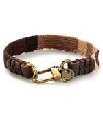 Leather and brasstone hardware bring a city edge to this canvas bracelet from Caputo.