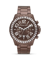 Make a sporty statement wit this cooly-hued watch from MICHAEL Michael Kors. Boating an oversized bezel and glitzy accents, it will add easy impact to every look.