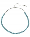 Add a subtle touch of color. Kenneth Cole New York's chic row of semi-precious turquoise beads is a winning addition to your collection. Set in silver tone mixed metal with a brown poly urethane cord. Approximate length: 18 inches + 3-inch extender.