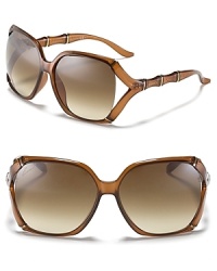 Bring a touch of the tropics to your accessories collection with these stunning Gucci sunglasses. The brand's signature bamboo motif makes for chic adornment.