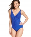 Crafted for a flattering fit, this beautiful one-piece swimsuit from Miraclesuit has an elegant crossover design and notched neckline you'll love.