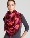 Rich, fall hues mix with on-trend neons in this kaleidoscope-print scarf from accessories brand Theodora & Callum.