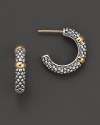 Sterling silver small caviar hoop earring with 18 Kt. accents. Designed by Lagos.