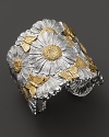 Blooming daisies and delicate butterflies make a feminine statement on Buccellati's hinged cuff.