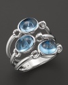 Three blue topaz stones make a statement on Di MODOLO's triple stone ring.