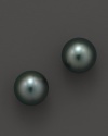 Naturally colored, cultured Tahitian black pearls make a statement on delicate stud earrings. From Tara Pearls.