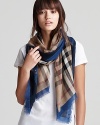 This signature Burberry scarf is the perfect way to tie up denim looks, with a vivid, blue border.