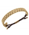 Watch out for sleek style. This adjustable bracelet from Michael Kors sports a linked, watch-inspired design. Adjustable with silk cord. Crafted in gold tone mixed metal. Approximate diameter: 2 to 2-1/2 inches. Approximate width: 1/3 inch.