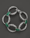 Malachite doubles connect fluted sterling silver loops on this link bracelet from Lagos.