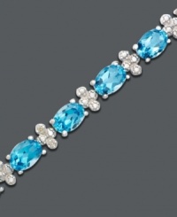 Caribbean cool color to brighten any day or night. Oval-cut blue topaz (14-1/2 ct. t.w.) and diamond accents sparkle like the ocean in this bracelet crafted in sterling silver. Approximate length: 7 inches.