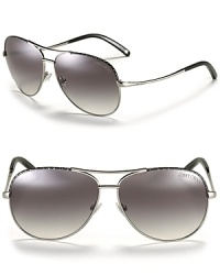 The classic aviator gets a luxurious touch with a leather mesh trim along top of frames.