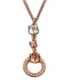 A design that speaks volumes about elegance -- this gold tone mixed metal pendant flaunts a cubic-cut clear Swarovski crystal on top. Followed by two Golden Shadow Swarovski crystals, the pendant ends with a ring of moonlight and golden shadow Swarovski crystals set in pavé. Approximate length: 15 inches. Approximate drop: 2 inches.