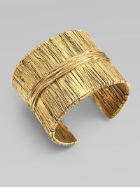 Richly textured with an organic look, this golden cuff has the sculptural appearance of wrapped and tied threads.GoldplatedDiameter, about 2¼Width, about 2Made in France