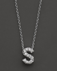 From the Tiny Treasures collection, a diamond S necklace. With signature ruby accent. Designed by Roberto Coin.