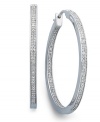 Icy cool. Round-cut diamonds (1/2 ct. t.w.) in a traditional hoop setting are a must-have for every girl's jewelry collection. Crafted in sterling silver. Approximate diameter: 1-1/2 inches.