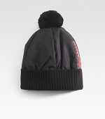 Nylon and wool puffer hat with pom pom detail.Ribbed hemNylon/woolDry cleanMade in Italy