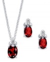 Crimson chic! Victoria Townsend's beautiful earrings and matching pendant feature oval-cut garnet (3-3/8 ct. t.w.) topped by a trio of sparkling diamond accents. Crafted in sterling silver. Approximate length: 18 inches. Approximate drop (pendant): 1/2 inch. Approximate drop (earrings): 1/2 inch.