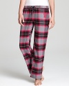 Update your PJs with these relaxed pink, black and gray flannel pants from DKNY.