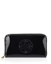 Accent every look with Tory Burch's wristlet in glossy patent leather.