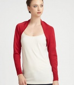 An open-front, long-sleeved knit design in a bold hue.Open frontLong cuffed sleevesAbout 10 from shoulder to hem80% rayon/20% nylonDry cleanImported