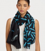 A smooth silk style that features a graphic, abstract lip print. SilkAbout 40 X 67Dry cleanImported 