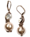 Indulge in this warmly colored earring style from Givenchy. Imitation pearls and crystal stones are showcased in a drop silhouette. Crafted in brown gold tone mixed metal. Approximate drop: 1-5/8 inches.