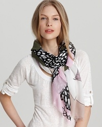 A nature-inspired scarf with earthy tones and leaf print.