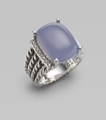 From the Wheaton Collection. A faceted cushion of milky blue chalcedony, edged by rows of diamonds, in a wide cable band of sterling silver. Diamonds, 0.16 tcw Blue chalcedony and diamonds Sterling silver Width, about ½ Imported 