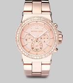 This feminine yet sturdy timepiece of rose goldtone stainless steel is framed in light peach crystals, with a link bracelet band that has shiny outer links and brushed center links.Chronograph movement Waterproof up to 10 ATM 43mm stainless steel case Light rose goldtone dial Round face Second hand Link bracelet Imported