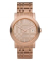 This Burberry watch features a check-inspired rose gold ion-plated stainless steel bracelet and round case. Rose gold tone dial with check pattern features applied stick indices, minute track, date window at three o'clock, three hands and logo. Swiss made. Quartz movement. Water resistant to 50 meters. Two-year limited warranty.