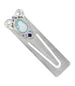 The perfect gift for the ultimate bookworm. This sentimental piece by Vatican features a blue enamel, cameo angel accented by sparkling light blue and Montana crystals. Crafted in silver tone mixed metal. Approximate length: 3 inches.